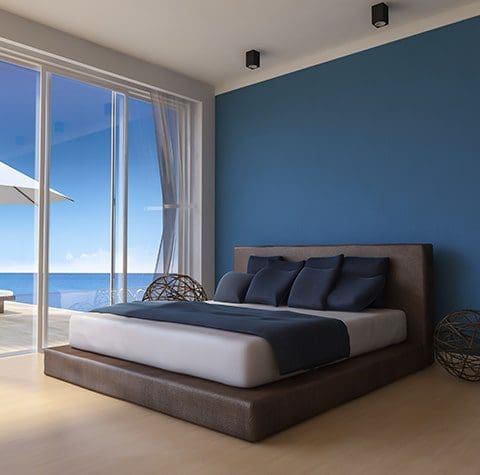 blue bedroom with windows