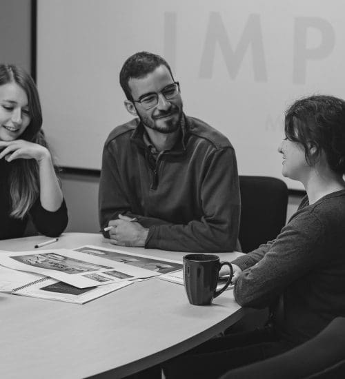 three people collaborating in meeting