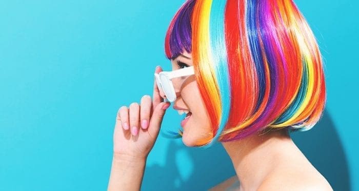 woman in glasses with rainbow hair
