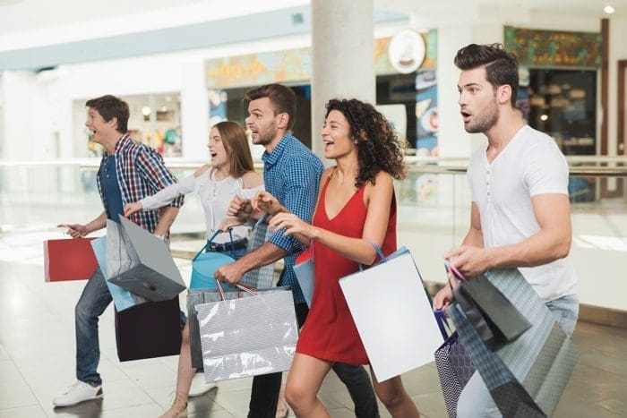 group of men and women shopping