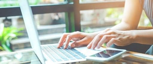 Woman typing on laptop